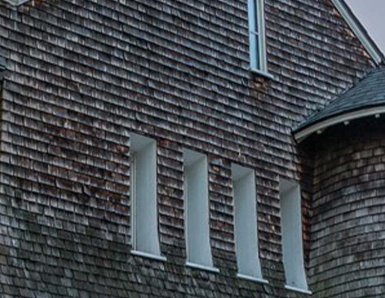 A close-up of gray roof shingles.