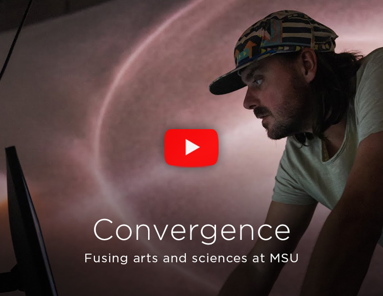 A person wearing a hat with the text: Convergence: Fusing arts and sciences at MSU.